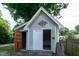 Outdoor shed with open doors and decorative iron design at 101 Stefi Ct, Garner, NC 27529