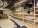 Unfinished basement with open storage and gym equipment, providing ample space for customization at 10101 Daviton Ct, Raleigh, NC 27615