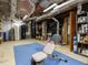 Spacious basement includes fitness equipment and storage, providing versatile space for recreation and organization at 10101 Daviton Ct, Raleigh, NC 27615