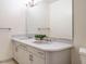 Bright bathroom featuring a double sink vanity with neutral countertop and large mirror at 10101 Daviton Ct, Raleigh, NC 27615