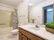 Well-lit bathroom features a shower-tub combination, a classic vanity, and a crisp, clean aesthetic at 10101 Daviton Ct, Raleigh, NC 27615