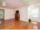Bedroom featuring hardwood floors, ceiling fan and built-in lamps at 10101 Daviton Ct, Raleigh, NC 27615