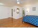 Bedroom with hardwood floors and 3 doors leading to other rooms of the house at 10101 Daviton Ct, Raleigh, NC 27615