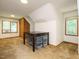 Bright bedroom boasts natural light, a closet, and wood accents, creating a warm and inviting atmosphere at 10101 Daviton Ct, Raleigh, NC 27615