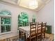 Elegant dining room with large arched windows and natural light at 10101 Daviton Ct, Raleigh, NC 27615