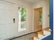 Bright entryway with decorative tile floors and a view of the outdoor front porch at 10101 Daviton Ct, Raleigh, NC 27615