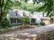 Two-story home with a two-car garage, dormer windows, stone accents, and a manicured front yard at 10101 Daviton Ct, Raleigh, NC 27615