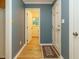 Hallway leading to an open bathroom with a window view at 10101 Daviton Ct, Raleigh, NC 27615