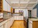 White kitchen with stainless steel appliances, granite countertops, and plenty of storage at 10101 Daviton Ct, Raleigh, NC 27615
