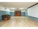 The spacious living room features wainscotting, a bookshelf, projector and screen, perfect for gatherings and entertainment at 10101 Daviton Ct, Raleigh, NC 27615