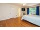 Main bedroom with hardwood flooring, a ceiling fan, and access to an outdoor balcony at 10101 Daviton Ct, Raleigh, NC 27615