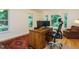 Bright home office with hardwood floors, natural light, a desk, and an office chair at 10101 Daviton Ct, Raleigh, NC 27615