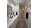 Bright bathroom with double vanity, spacious shower, and modern fixtures, offering a spa-like experience at 108 Sweetbay Park, Youngsville, NC 27596