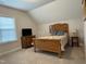 Bright bedroom with a large window and carpeted floors, offering a relaxing retreat with ample space at 108 Sweetbay Park, Youngsville, NC 27596