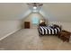 Spacious bedroom in finished attic space with carpeted floors, perfect for relaxation and privacy at 108 Sweetbay Park, Youngsville, NC 27596