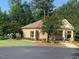 Exterior of the well-maintained community center with manicured landscaping and ample parking at 108 Sweetbay Park, Youngsville, NC 27596