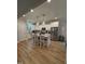 Bright kitchen featuring a large island, granite countertops, stainless steel appliances, and modern pendant lighting at 108 Sweetbay Park, Youngsville, NC 27596