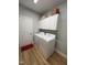 Functional laundry room with washer, dryer, and storage cabinets, offering convenience and organization at 108 Sweetbay Park, Youngsville, NC 27596