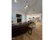 Open-concept living room showcasing a fireplace and seamless transition to the kitchen, perfect for modern living at 108 Sweetbay Park, Youngsville, NC 27596