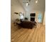 Inviting living room featuring a fireplace, vaulted ceiling, and stylish decor, creating a cozy and elegant atmosphere at 108 Sweetbay Park, Youngsville, NC 27596