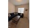 Cozy living room featuring a plush blue sectional sofa and a dark wood coffee table, perfect for relaxing at 108 Sweetbay Park, Youngsville, NC 27596