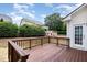 The backyard has a wood deck and a small playhouse at 10847 Bedfordtown Dr, Raleigh, NC 27614