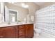 Bathroom with double sink vanity and decorative shower curtain at 10847 Bedfordtown Dr, Raleigh, NC 27614