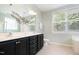 Bathroom featuring a dual-sink vanity, a bathtub, a toilet, and natural light at 10847 Bedfordtown Dr, Raleigh, NC 27614