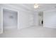 Light bedroom features soft carpet, neutral paint, large windows, crown moulding, and a ceiling fan at 10847 Bedfordtown Dr, Raleigh, NC 27614