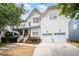 Picture of a beautiful two-story home featuring an attached two-car garage and a manicured front yard at 10847 Bedfordtown Dr, Raleigh, NC 27614