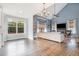 Spacious living room has vaulted ceilings, a fireplace, lots of natural light, and hardwood floors at 10847 Bedfordtown Dr, Raleigh, NC 27614