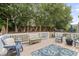 Outdoor deck featuring patio seating and decorative string lights at 10859 Bedfordtown Dr, Raleigh, NC 27614