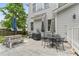 Back patio with patio dining set and gas grill at 10859 Bedfordtown Dr, Raleigh, NC 27614