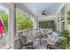 Spacious back porch featuring seating, a ceiling fan, and a swing at 10859 Bedfordtown Dr, Raleigh, NC 27614