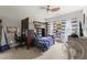 Bedroom featuring a ceiling fan, bunk beds with study space underneath and large windows at 10859 Bedfordtown Dr, Raleigh, NC 27614
