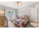 Bright bedroom featuring two twin beds with white frames and plush rugs at 10859 Bedfordtown Dr, Raleigh, NC 27614