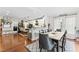 Stylish dining area adjacent to the kitchen with hardwood floors, ample seating, and natural light at 10859 Bedfordtown Dr, Raleigh, NC 27614