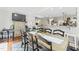 Eat-in dining area open to the kitchen features a rustic table and bar seating at 10859 Bedfordtown Dr, Raleigh, NC 27614