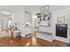 Bright entryway with hardwood floors, built-in storage, and charming decor creates a welcoming space at 10859 Bedfordtown Dr, Raleigh, NC 27614