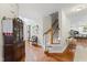 Welcoming foyer with staircase and wood floors at 10859 Bedfordtown Dr, Raleigh, NC 27614
