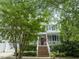 Charming two-story home with inviting porch, landscaped yard, and two-car garage at 10859 Bedfordtown Dr, Raleigh, NC 27614