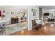Elegant hallway showcasing hardwood floors, decorative furnishings, and open access to other rooms at 10859 Bedfordtown Dr, Raleigh, NC 27614