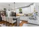 Modern kitchen featuring granite countertops, stainless steel appliances, and a stylish breakfast bar at 10859 Bedfordtown Dr, Raleigh, NC 27614