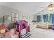 Bright playroom with vaulted ceiling, playhouse, and comfortable seating at 10859 Bedfordtown Dr, Raleigh, NC 27614
