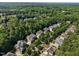 Aerial view of a neighborhood with mature trees and well-maintained homes at 109 Aspenridge Dr, Holly Springs, NC 27540