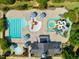Aerial view of the community pool, slides, and recreational water areas at 109 Aspenridge Dr, Holly Springs, NC 27540