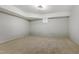 Finished basement space featuring neutral carpet, ample lighting, and a single window at 109 Aspenridge Dr, Holly Springs, NC 27540