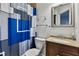 Bathroom featuring a toilet, vanity, mirror, and shower with a blue curtain at 109 Aspenridge Dr, Holly Springs, NC 27540