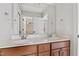 Large bathroom vanity with double sinks, granite countertop, and ample storage space at 109 Aspenridge Dr, Holly Springs, NC 27540