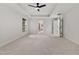 Large bedroom with neutral walls, plush carpeting, and a ceiling fan for added comfort at 109 Aspenridge Dr, Holly Springs, NC 27540